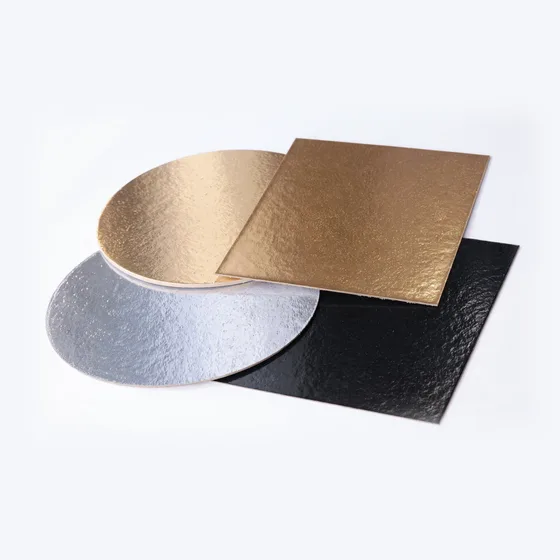 Gold, silver, and black die-cut round and square cake boards